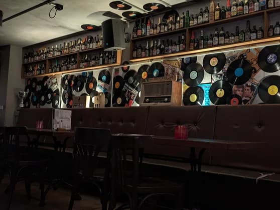 A bar with a wall of vinyl records